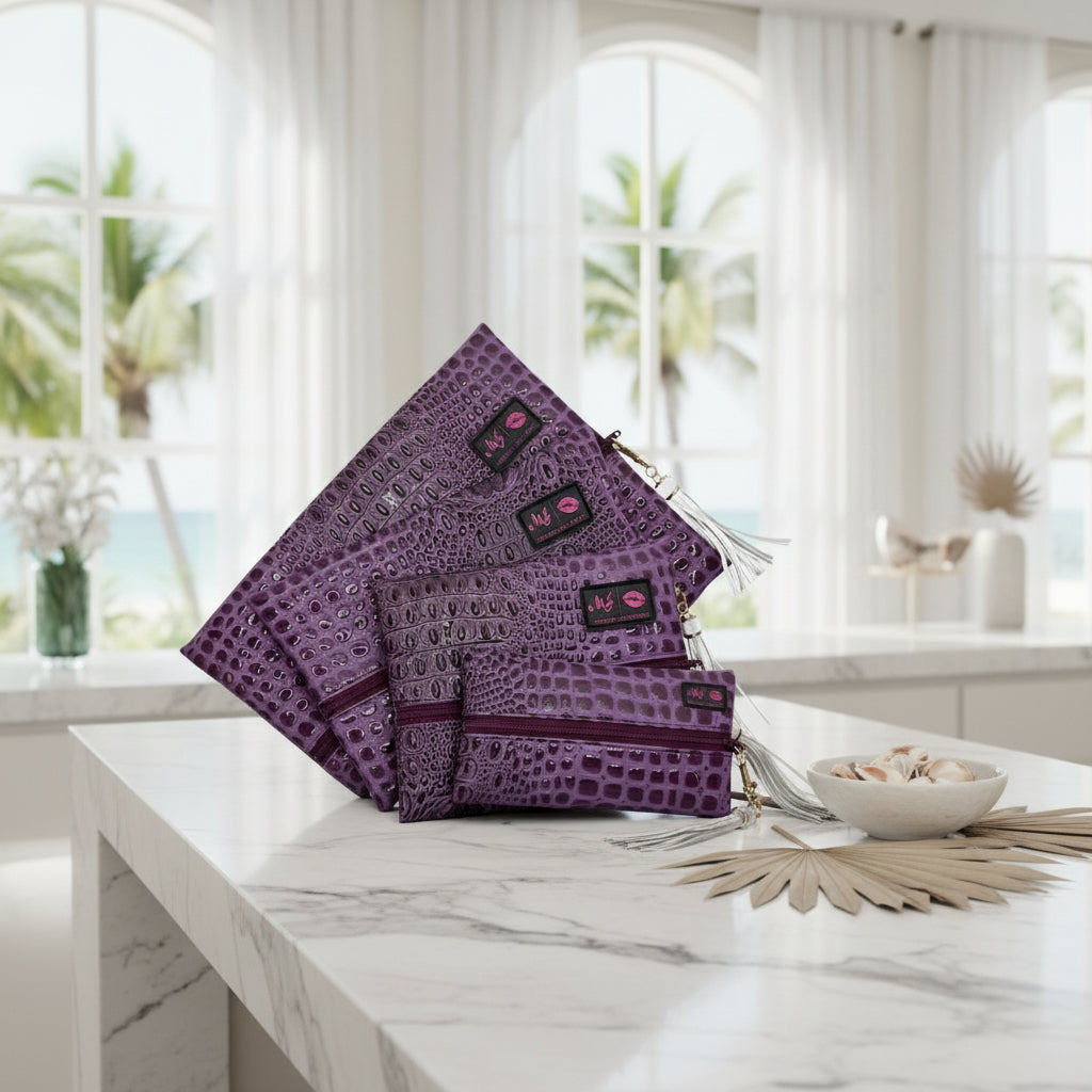 Purple textured clutch bags with tassels on a white background
