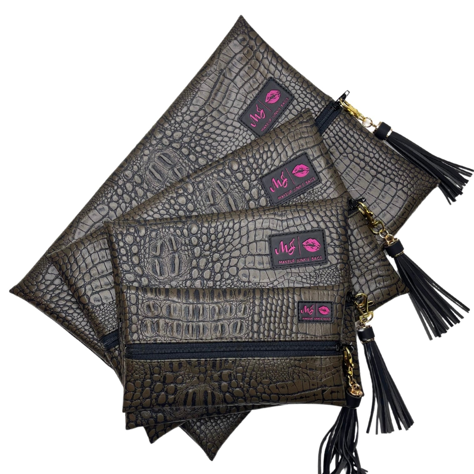 Set of gray crocodile-textured pouches with black tassels and pink logo tags on a white background