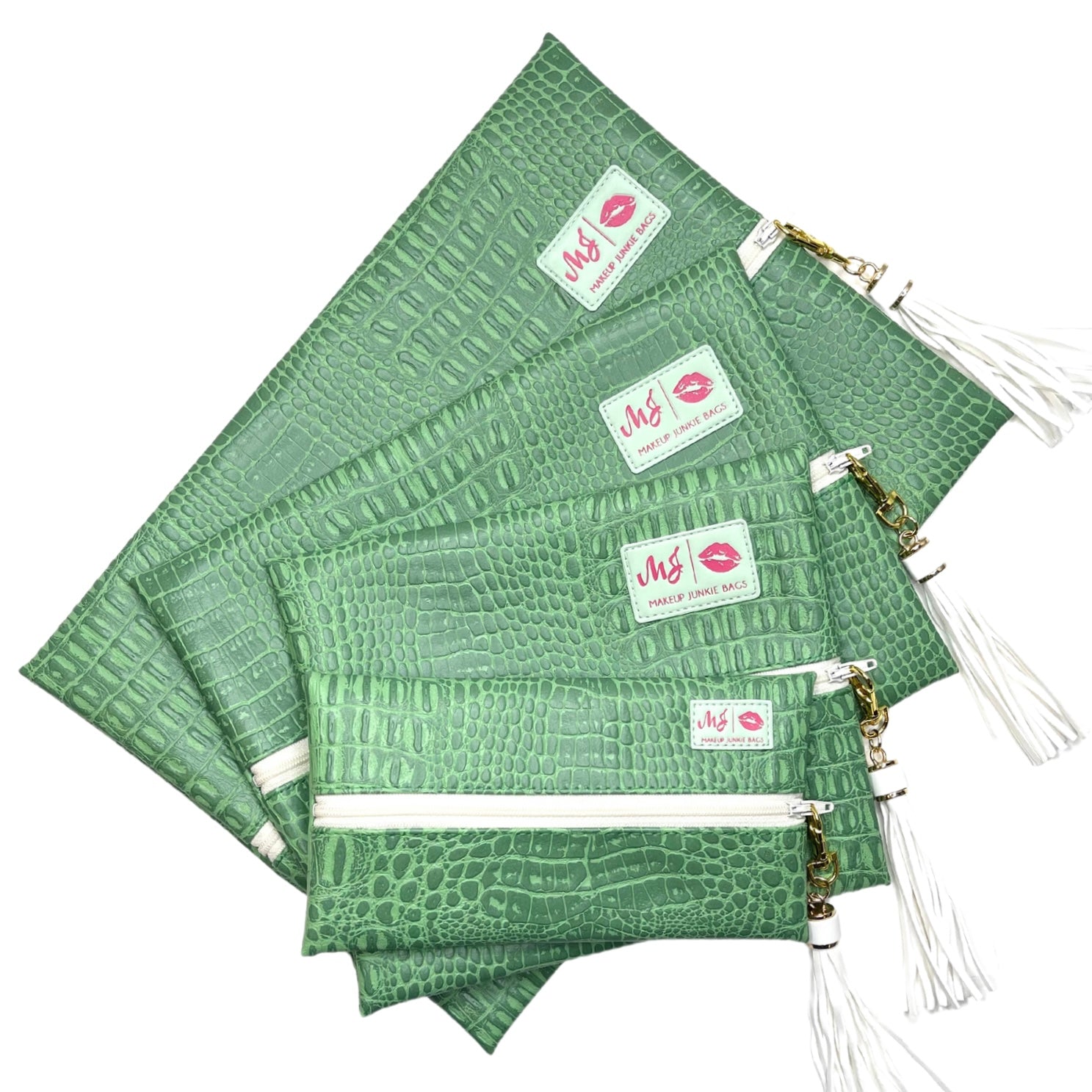 Set of green patterned pouches with visible branding on a white background
