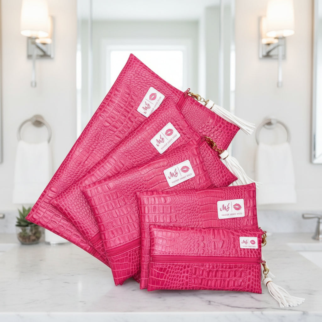 Set of pink textured pouches with visible brand logo on a white background