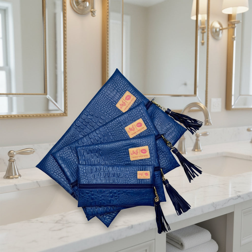 Set of blue clutch bags with tassels on a white background