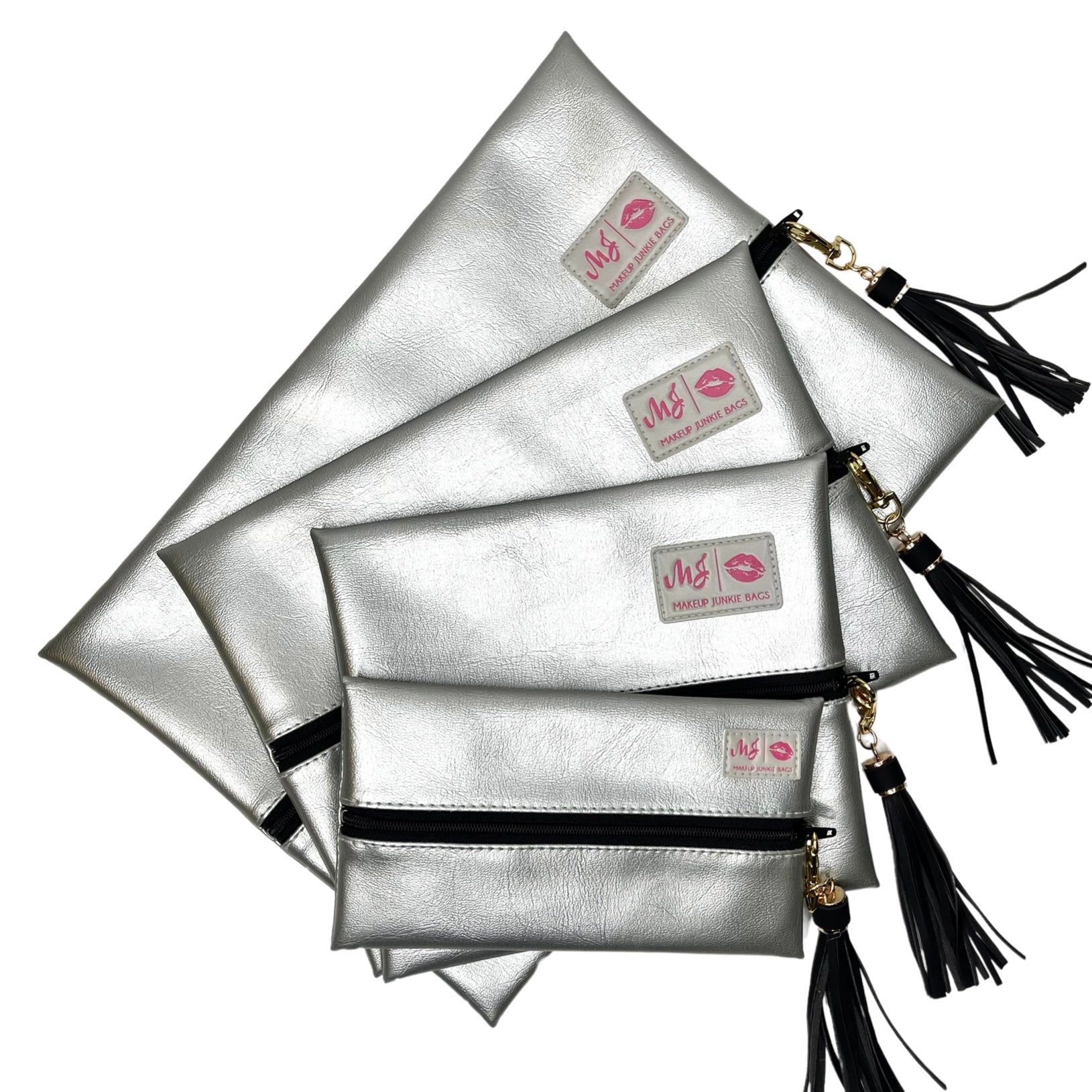 Silver clutch bags with black straps and tassels on a white background