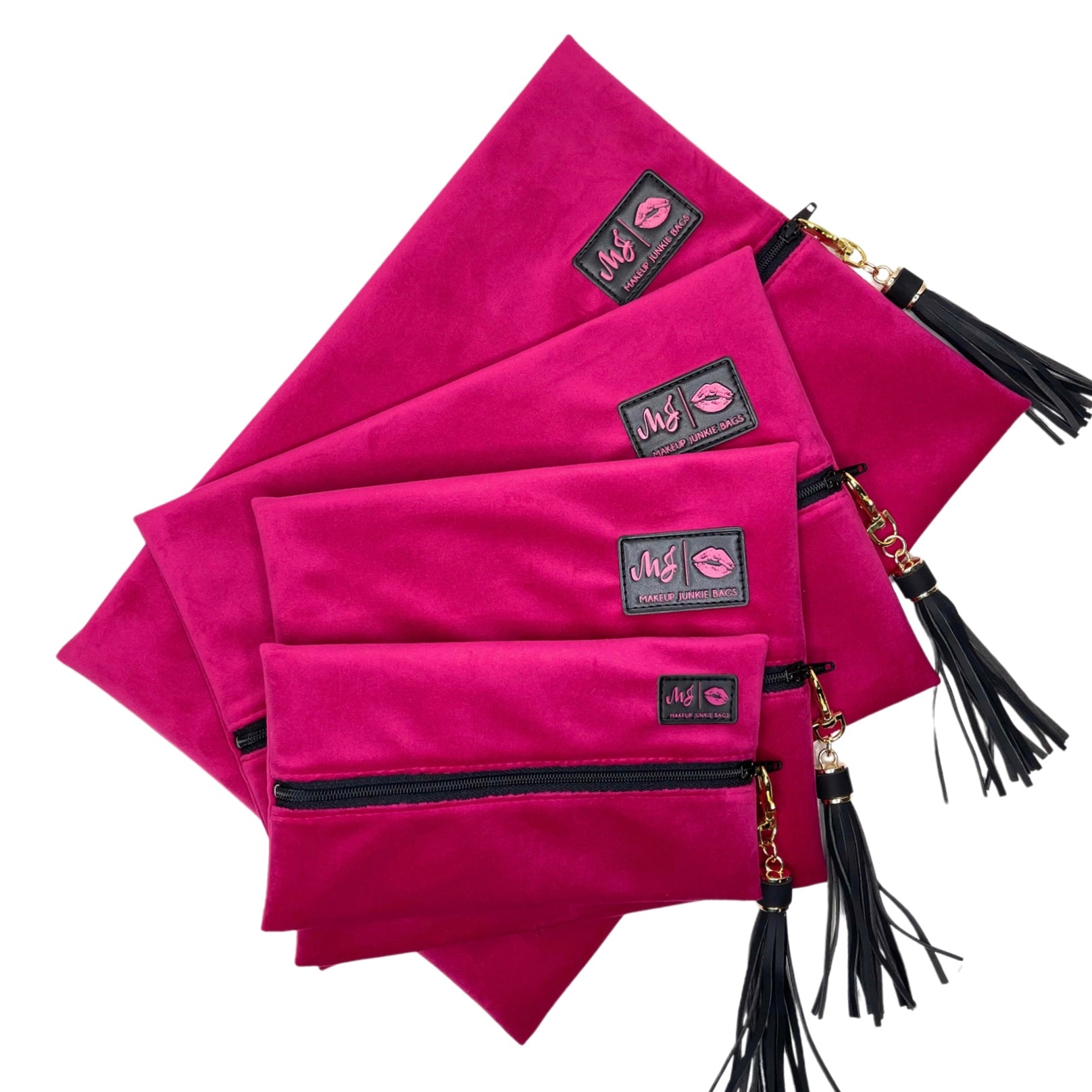 Set of pink pouches with black tassels and visible brand logo on a white background