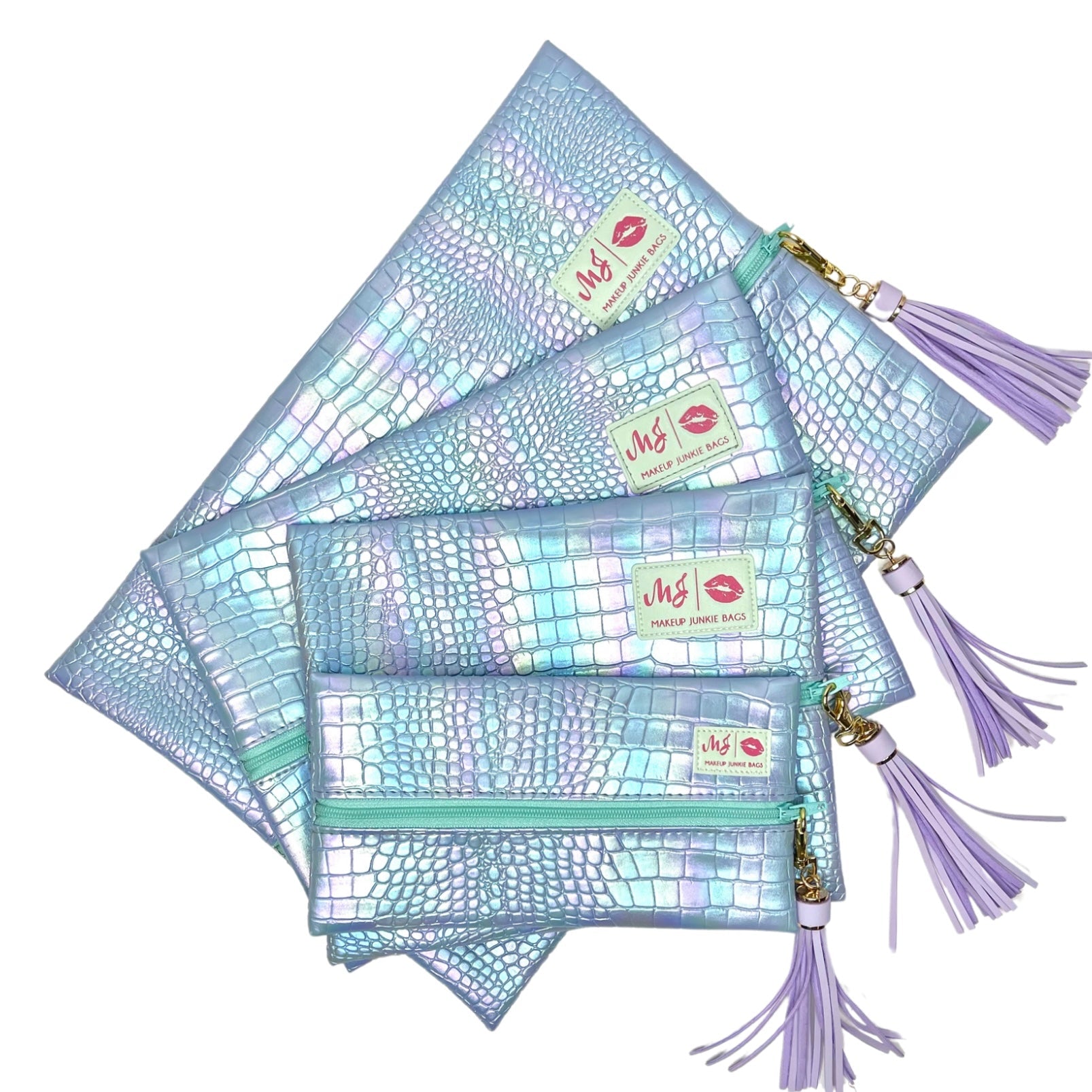 Set of holographic makeup bags with tassels on a white background