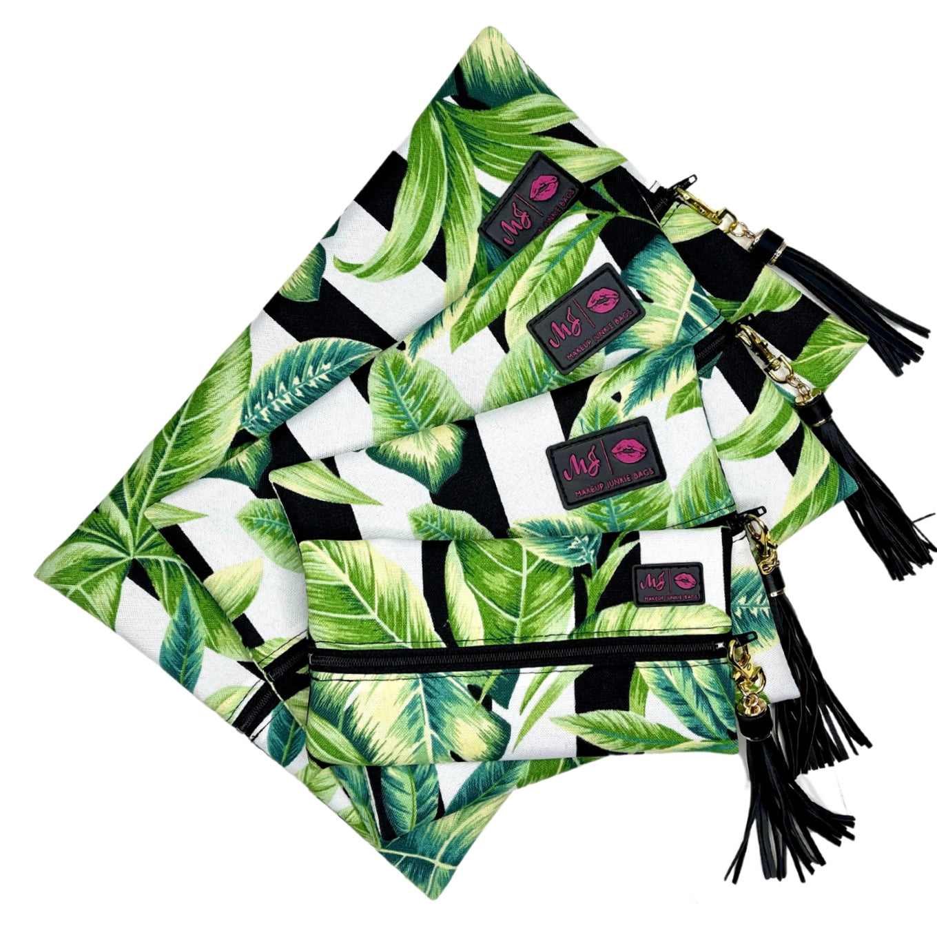 Set of pouches with tropical leaf pattern and tassels on a white background