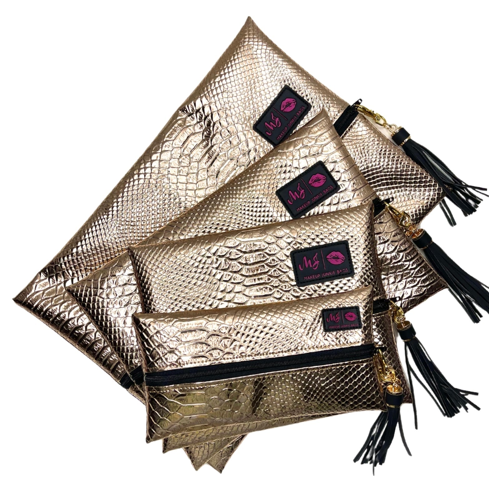 Gold clutch bags with black tassels and visible brand logo on a white background