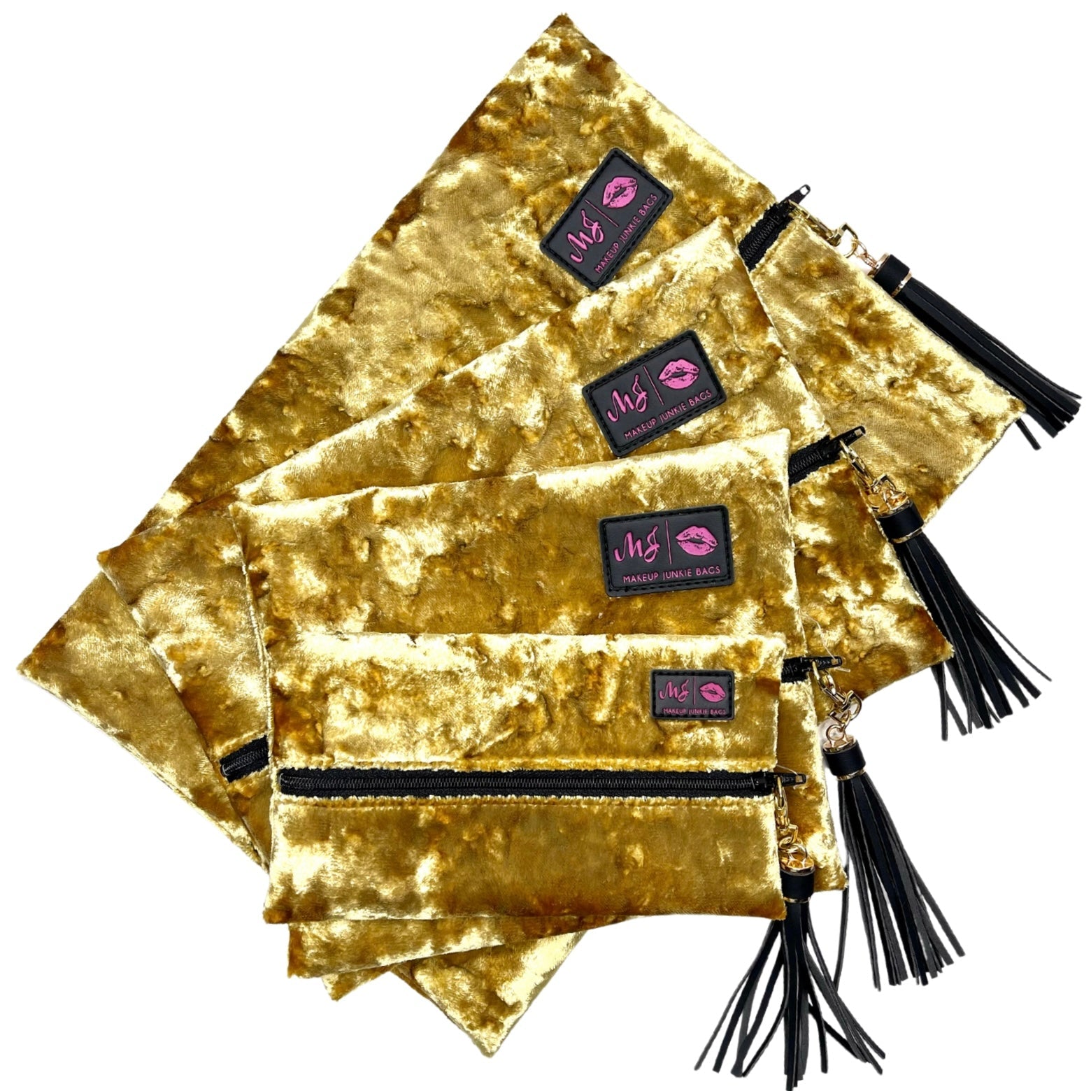 Gold velvet pouches with black tassels and visible brand logo on a white background
