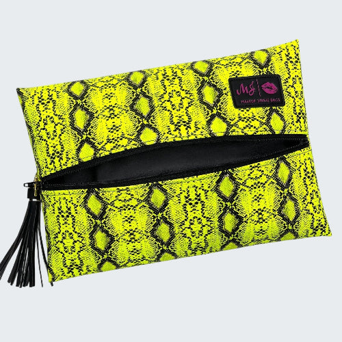 Yellow snake print pouch with black zipper and tassel on a white background