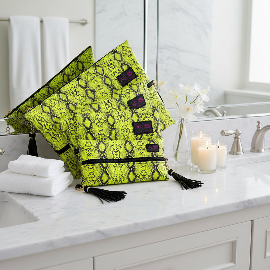 Neon green snake print bag with black tassels and visible brand labels on a white background