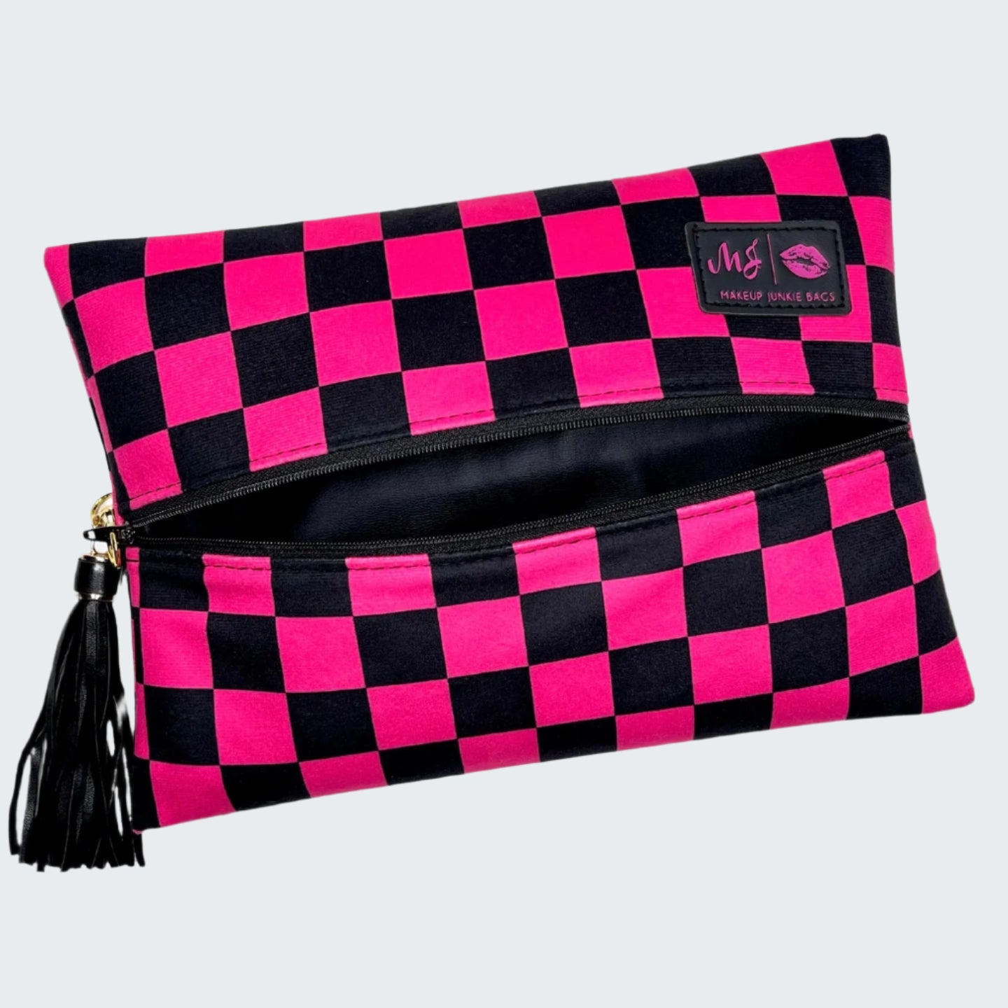 Pink and black checkered makeup bag with a visible brand logo on a white background