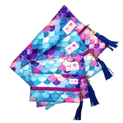 Colorful mermaid scale pattern bags with tassels on a white background