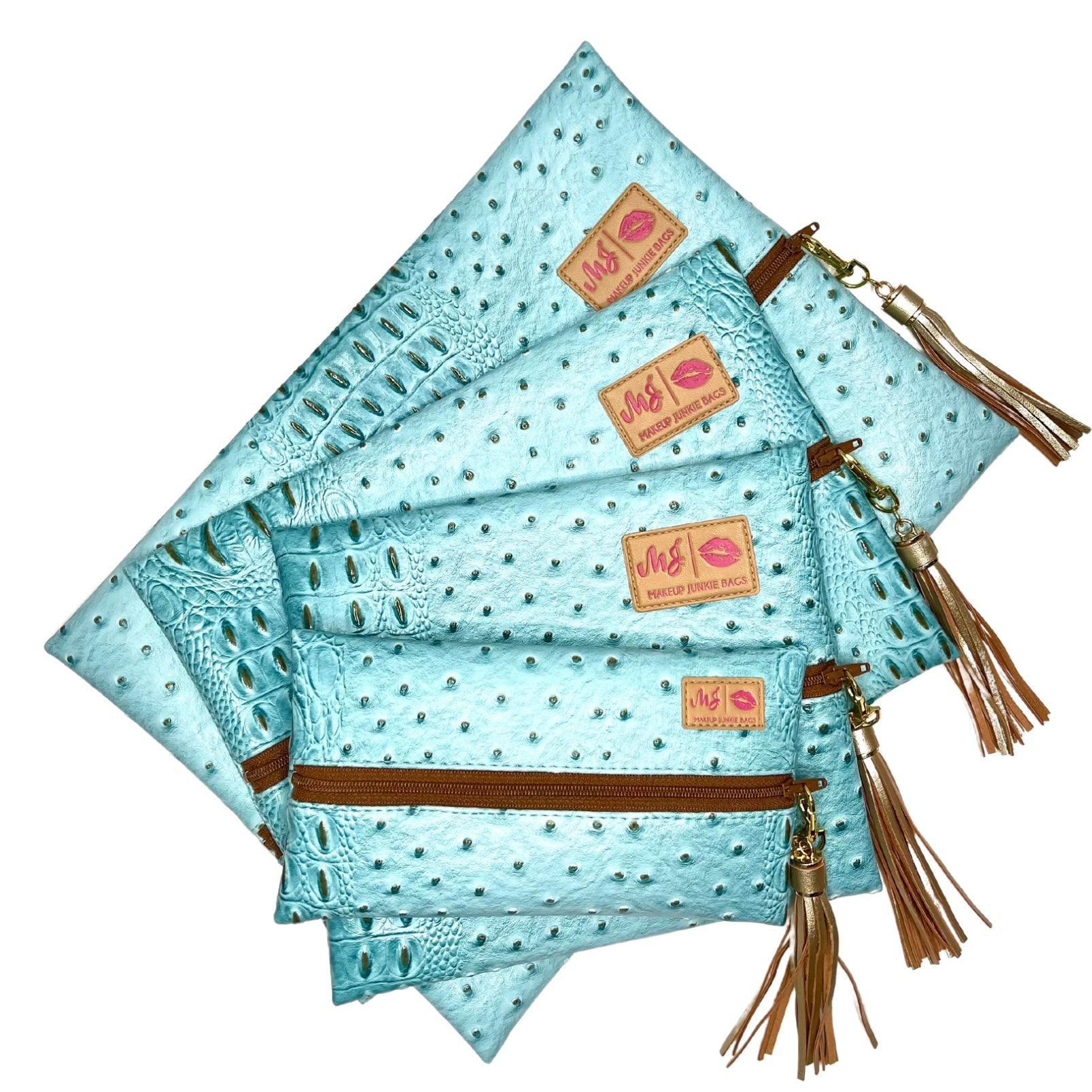 Set of turquoise bags with brown accents and tassels on a white background