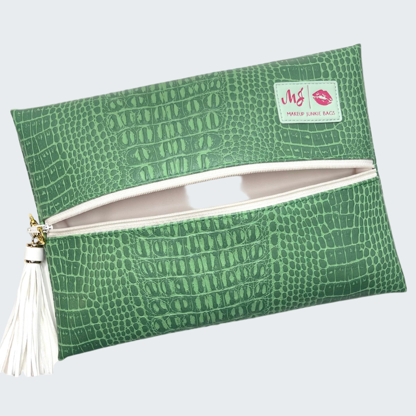 Green crocodile pattern pouch with a visible brand logo on a white background