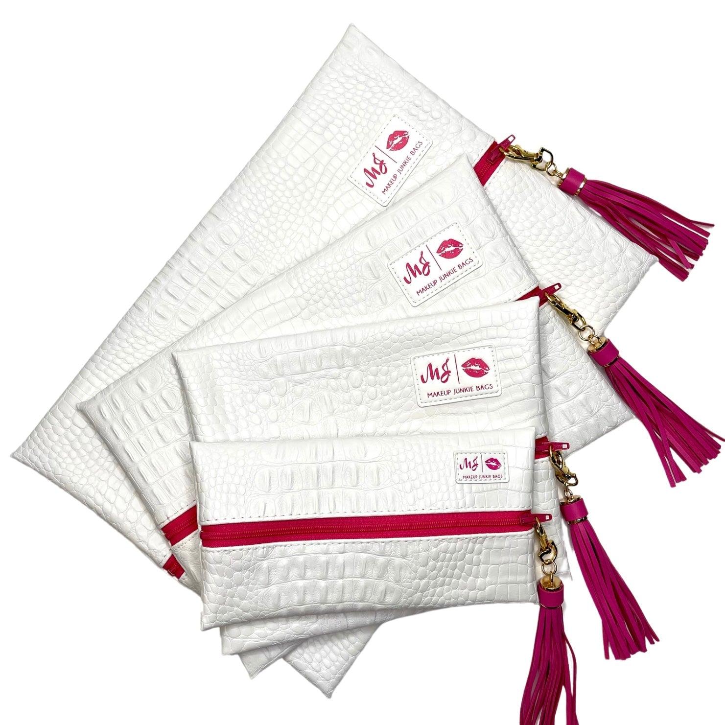Set of white makeup bags with red zippers and tassels on a white background