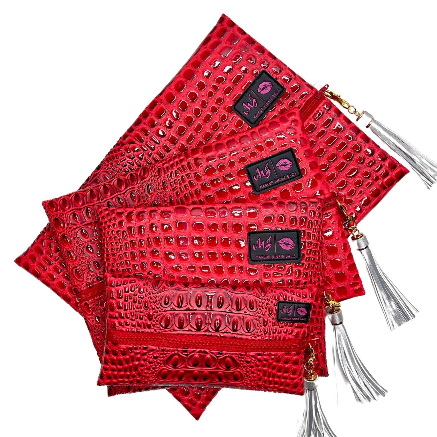 Red textured clutch with gold accents and tassels on a white background