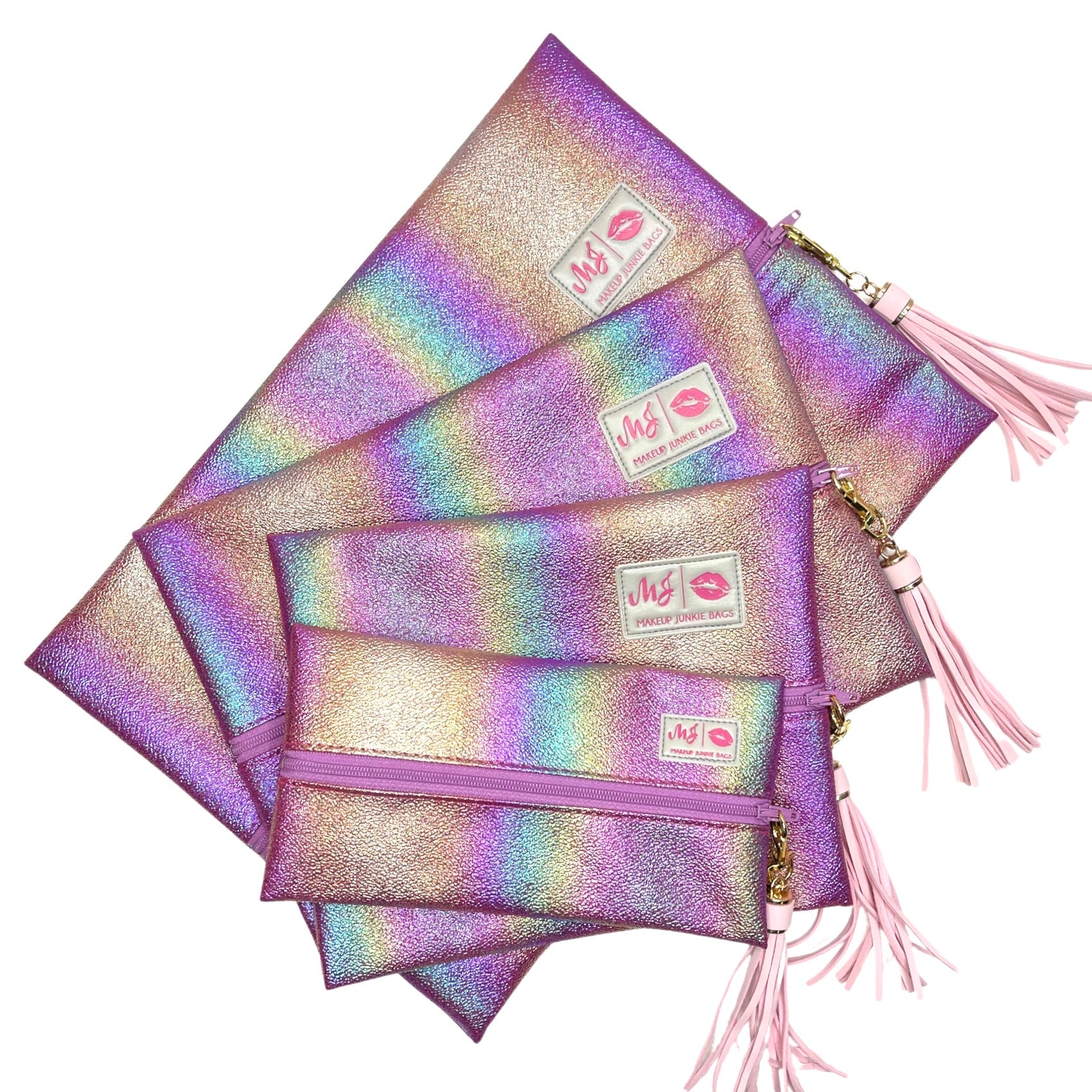 Set of glittery makeup bags with pink tassels on a white background
