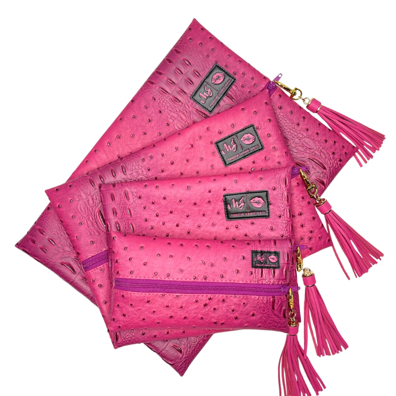 Set of pink handbags with tassels on a white background