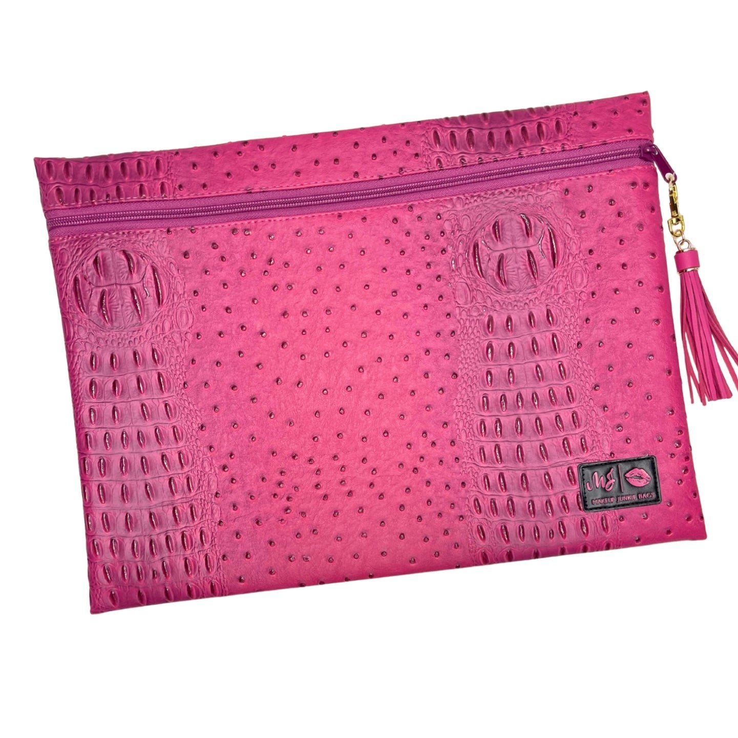 Pink textured pouch with a zipper and tassel on a white background