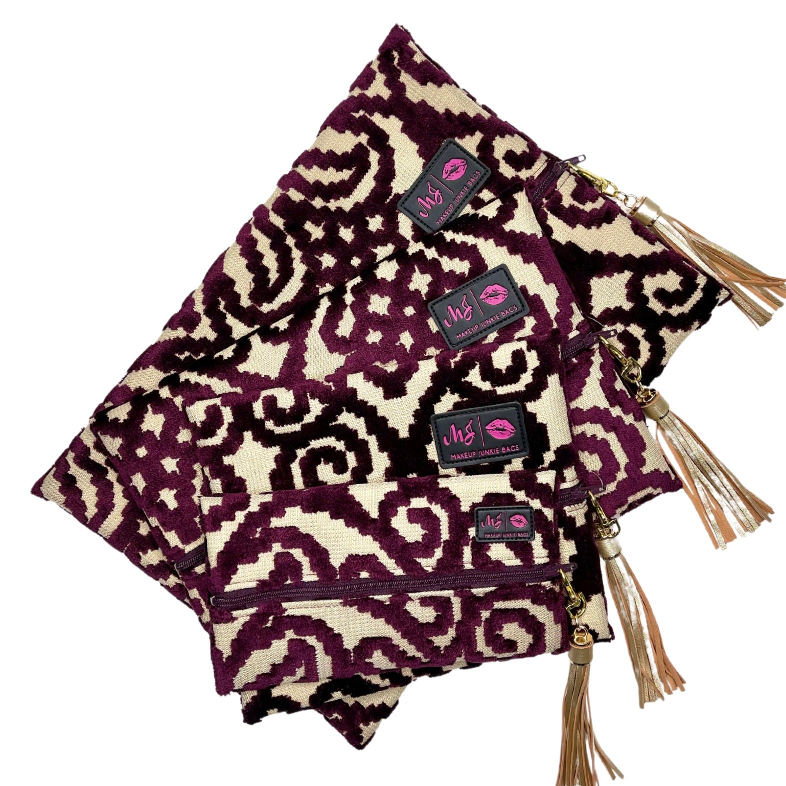 Purple and beige patterned bag with tassels and a visible brand tag on a white background