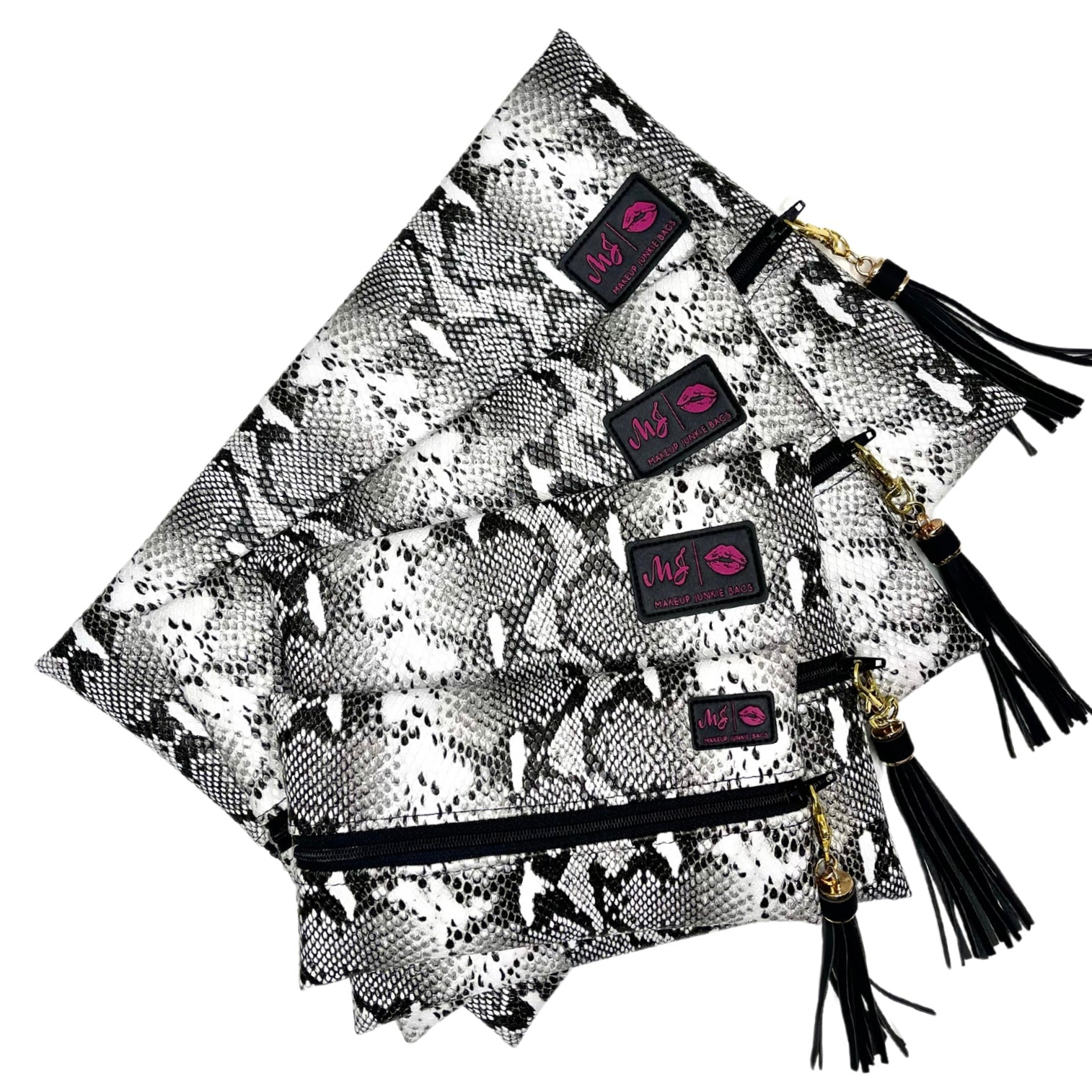 Set of black and white patterned bags with tassels and visible brand logos on a white background