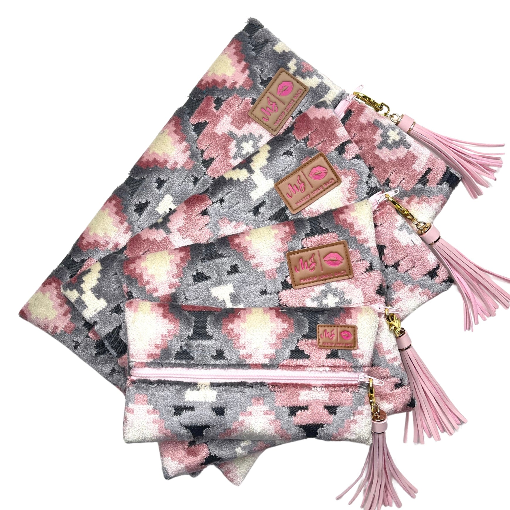 Set of patterned pouches with tassels on a white background