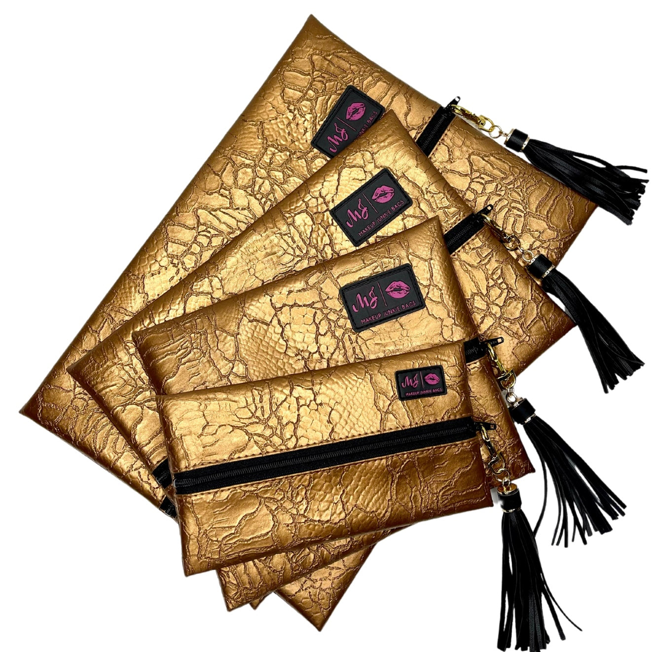 Set of gold clutch bags with black tassels and visible brand logo on a white background