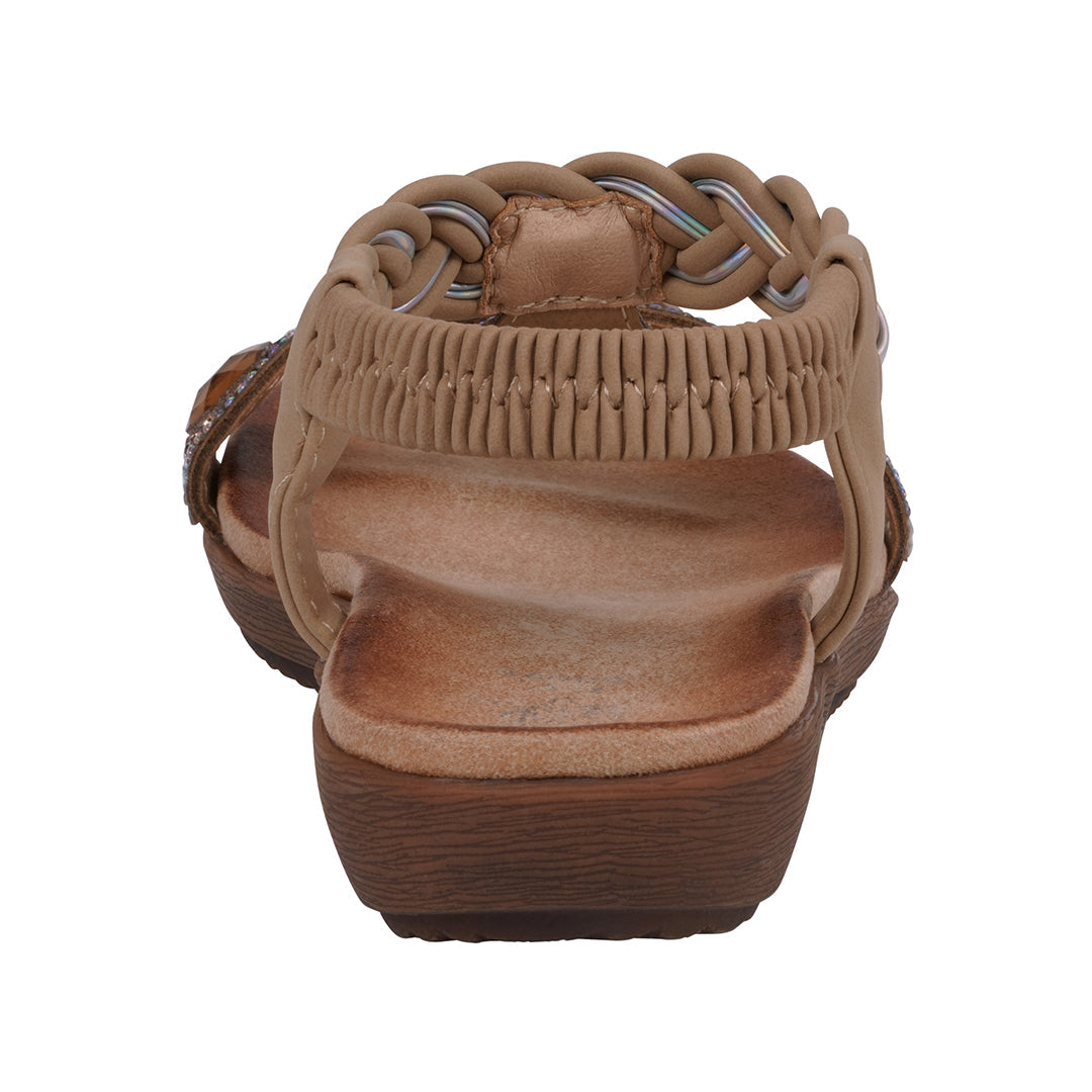 Brown sandal with wooden sole on a white background