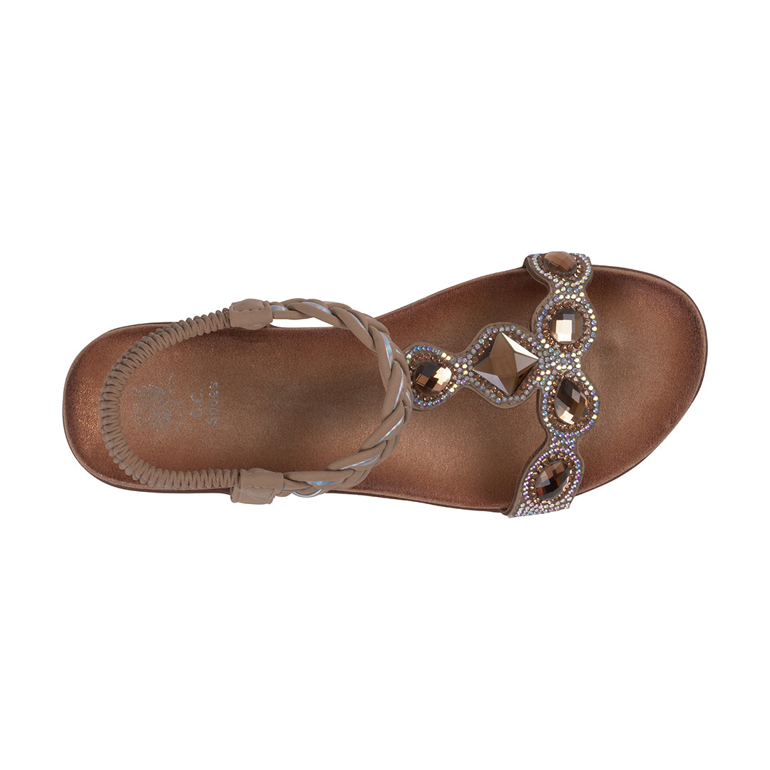 Brown sandal with decorative straps on a white background