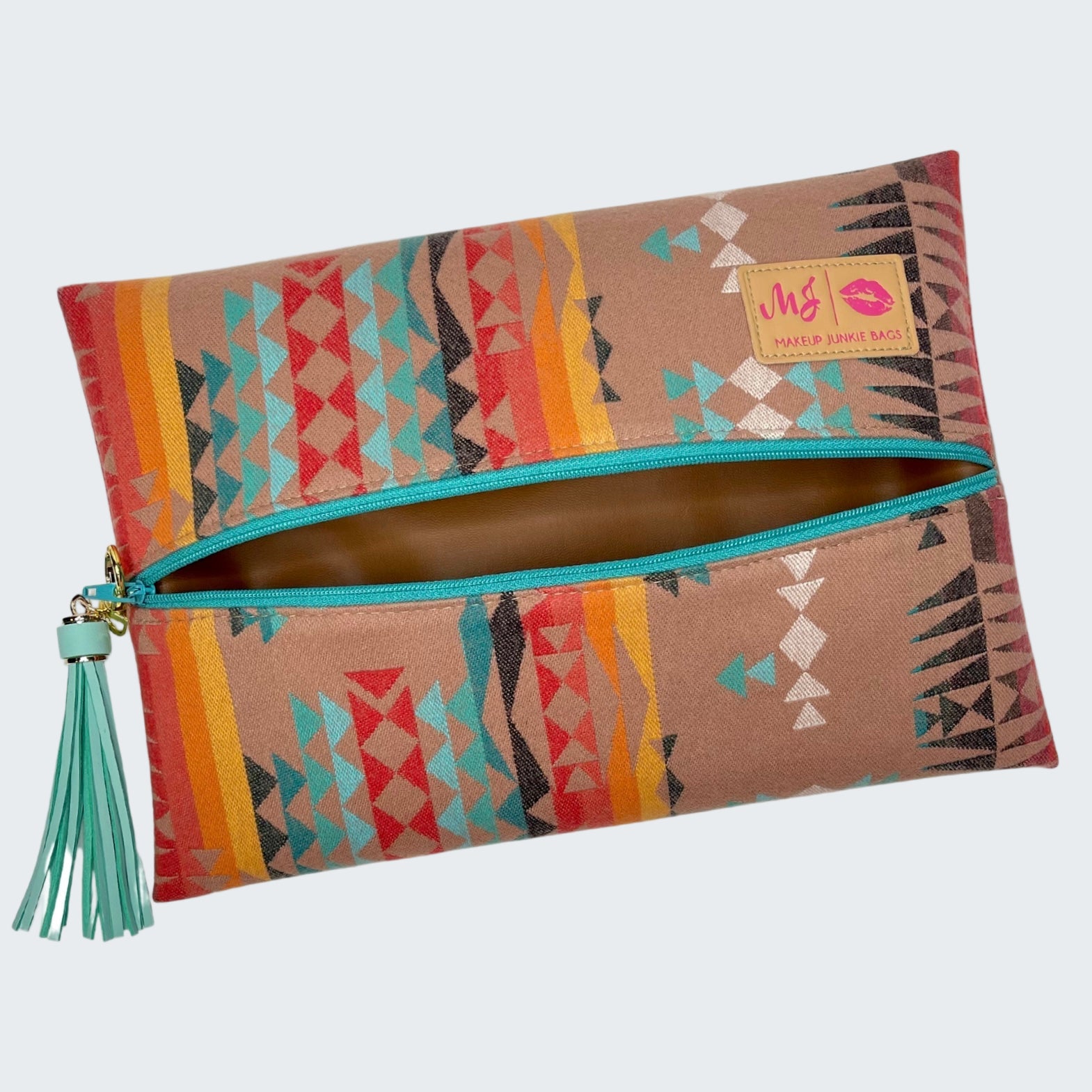 Colorful patterned pouch with a tassel on a white background