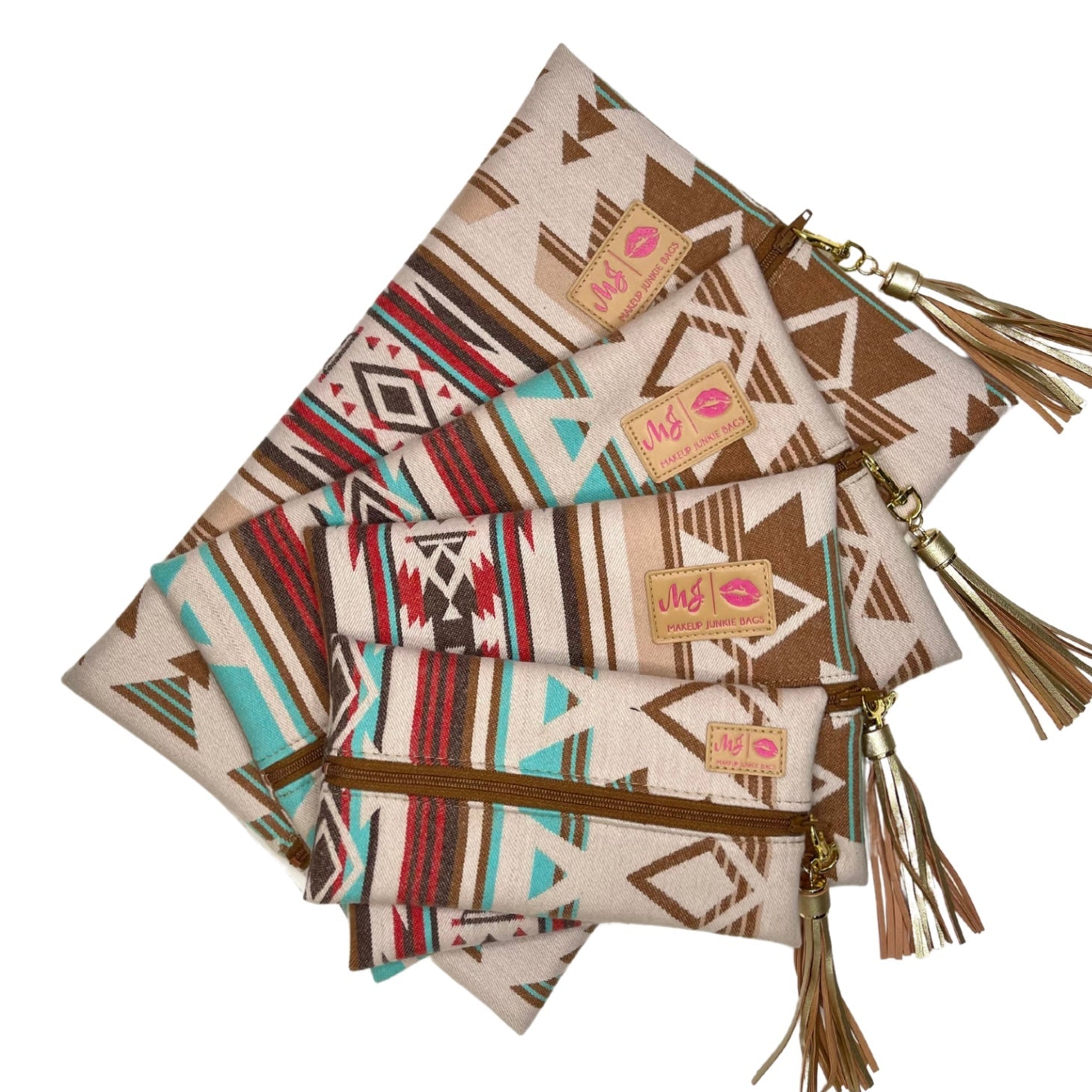Set of patterned pouches with tassels and visible brand labels on a white background