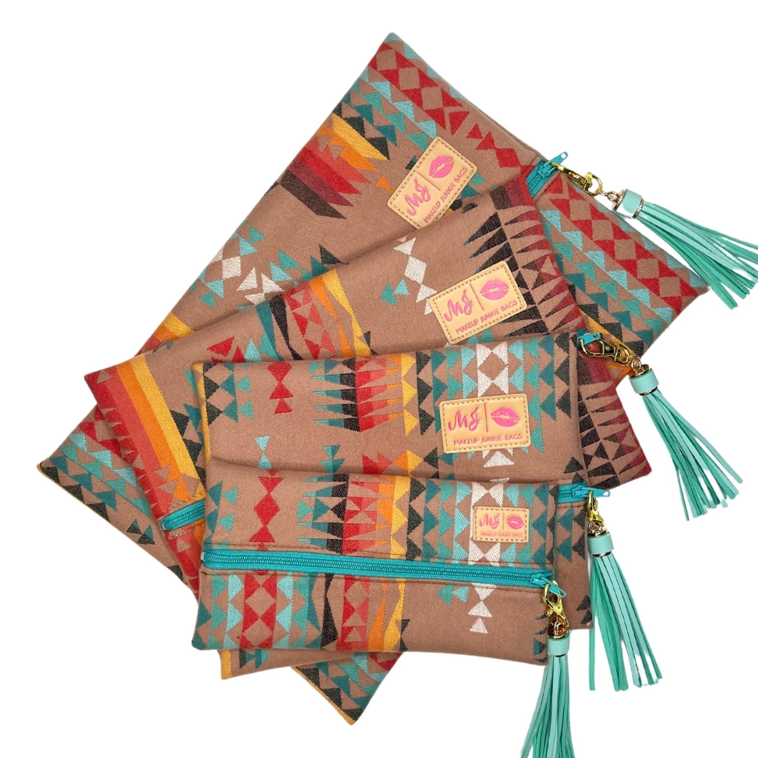 Set of patterned bags with turquoise tassels on a white background