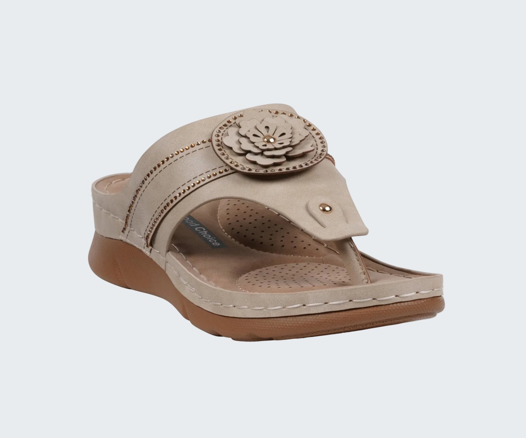 Beige sandal with a floral design on a white background
