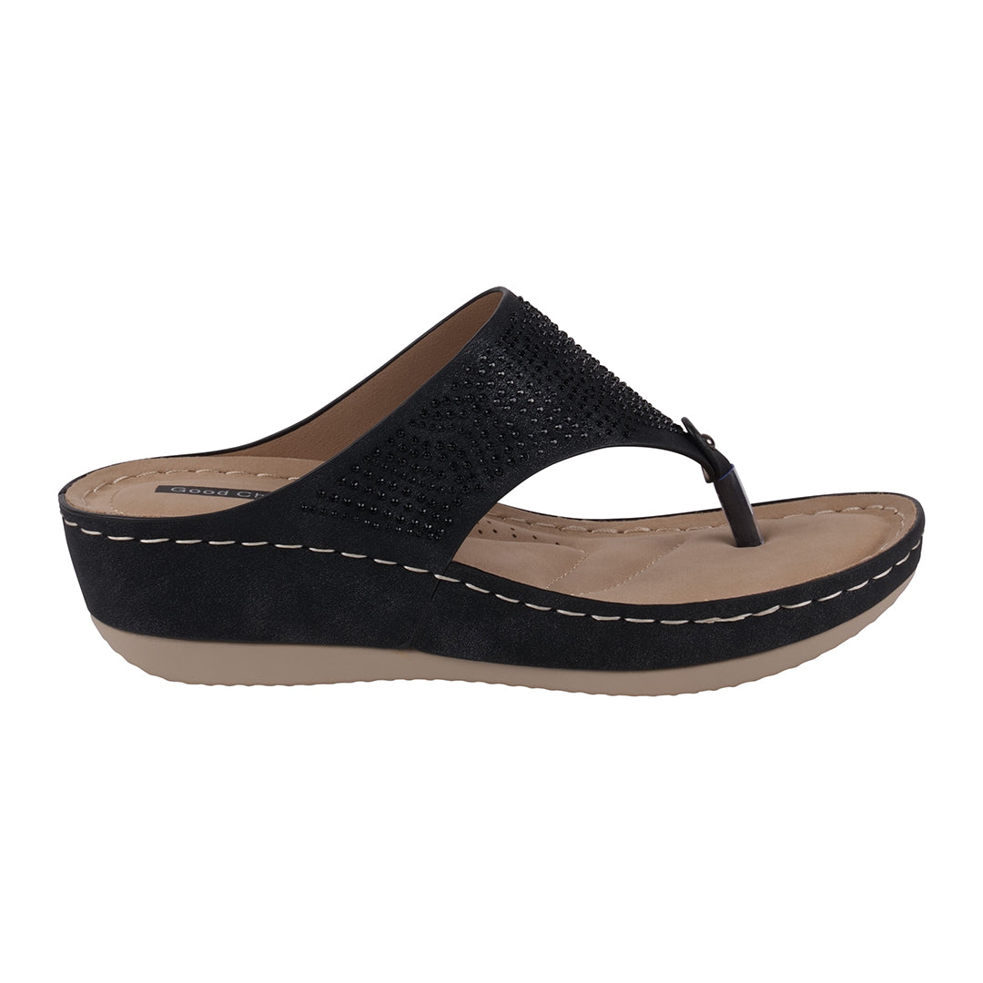 Black sandal with a beige sole on a white background