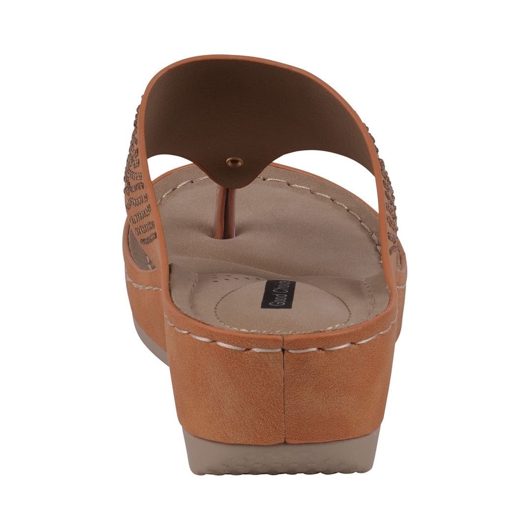 Brown sandal with a white sole on a white background