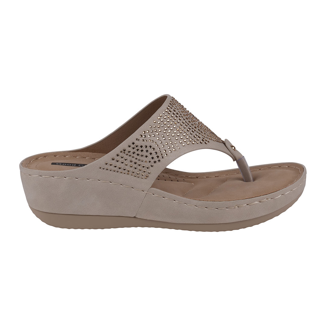 Beige sandal with a textured strap on a white background