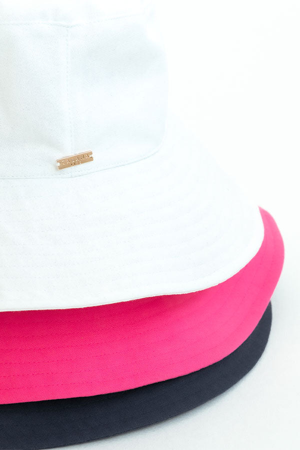 Two headbands, one pink and one black, on a white background.