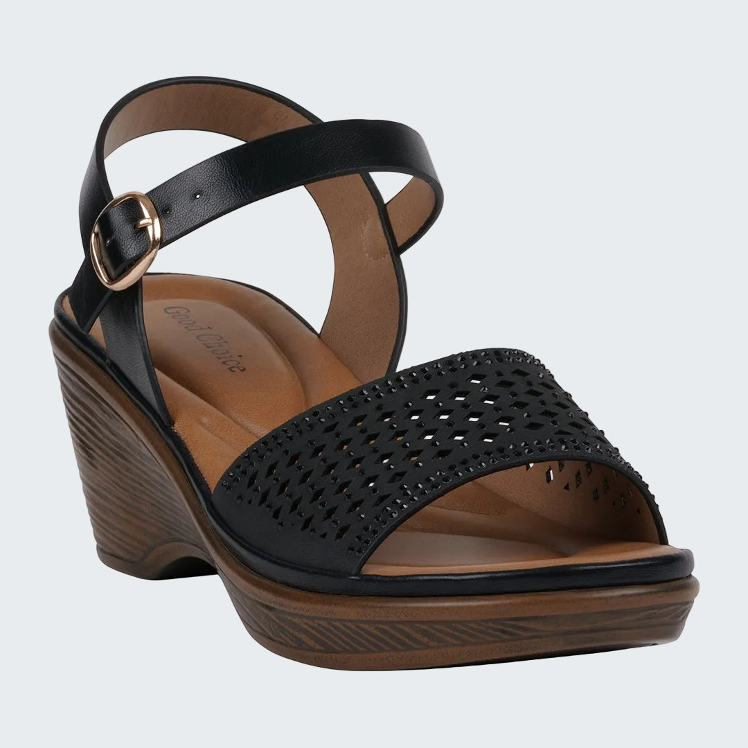 Black wedge sandal with a strap and gold buckle on a white background