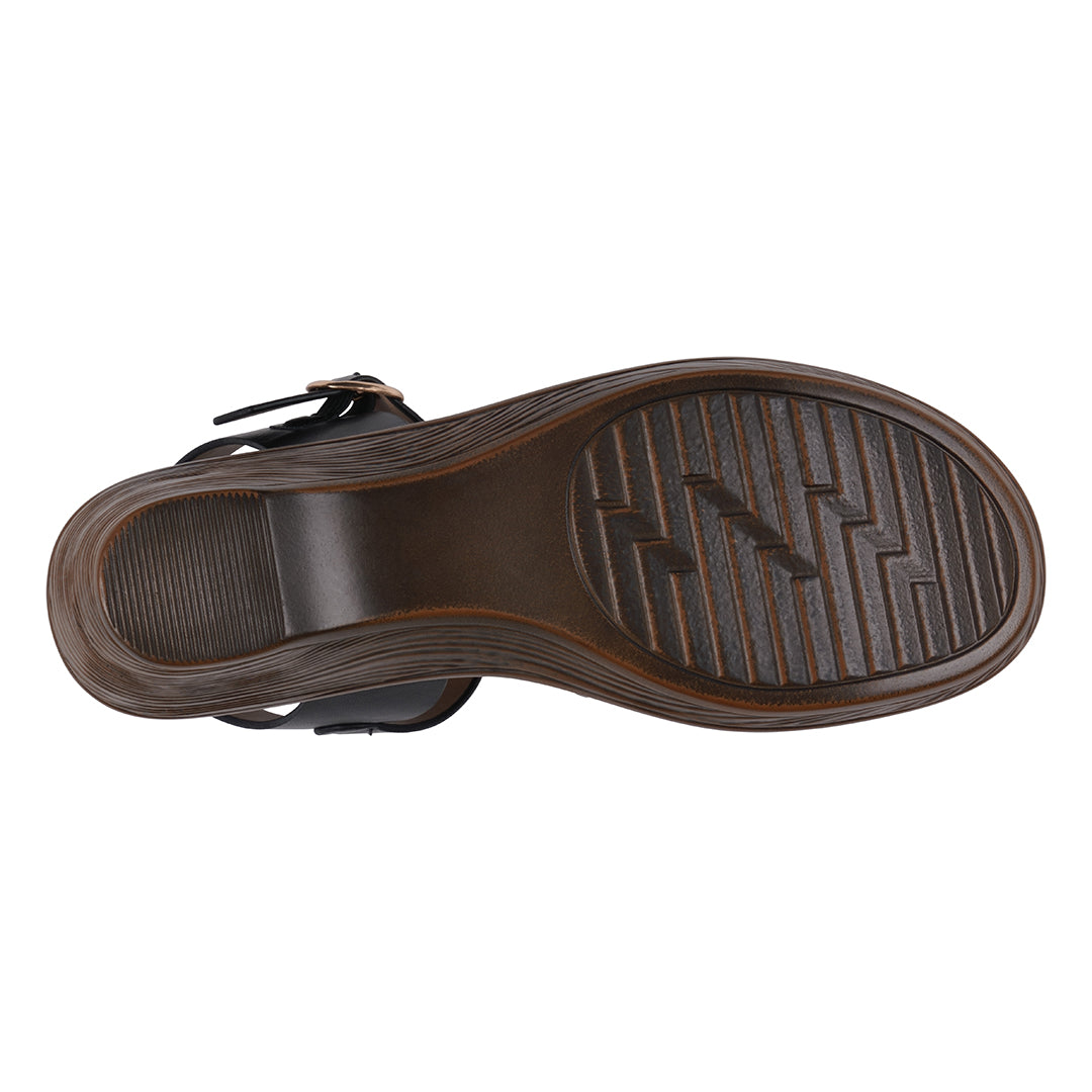 Brown sandal sole with tread pattern on a white background