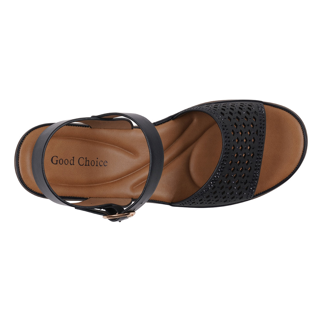 Brown sandal with black straps and perforated design on a white background