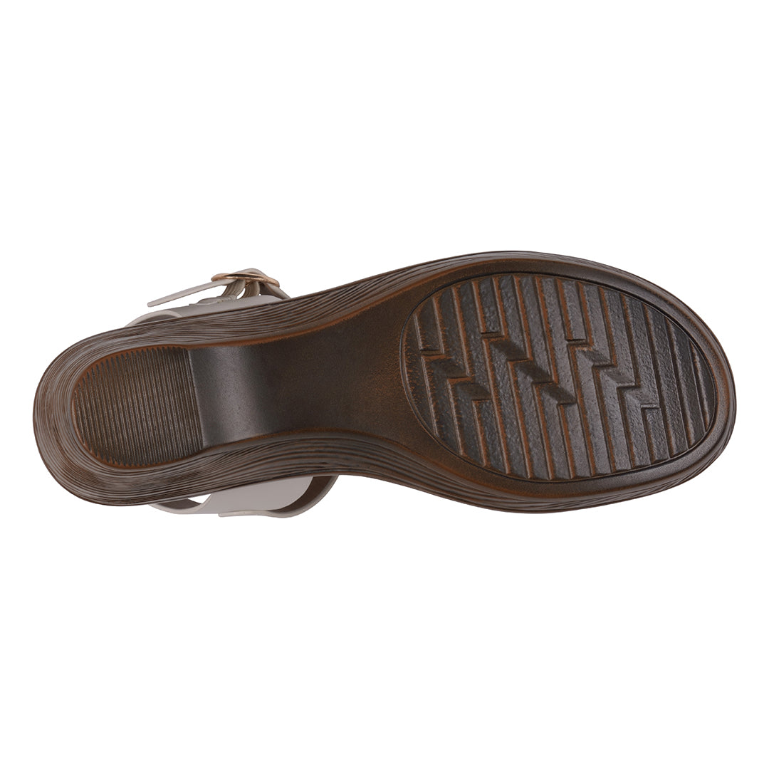 Brown sandal sole with textured pattern on a white background