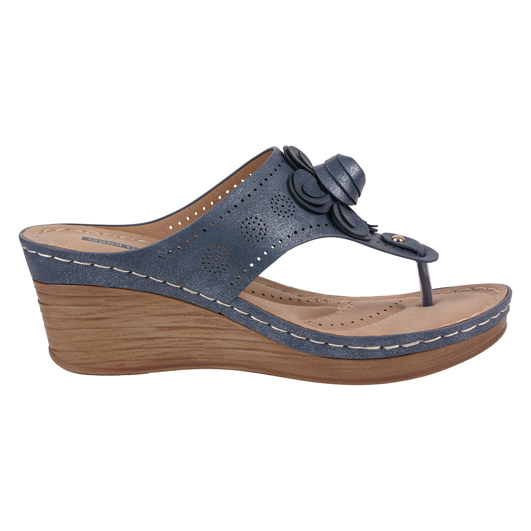 Blue wedge sandal with wooden sole on a white background