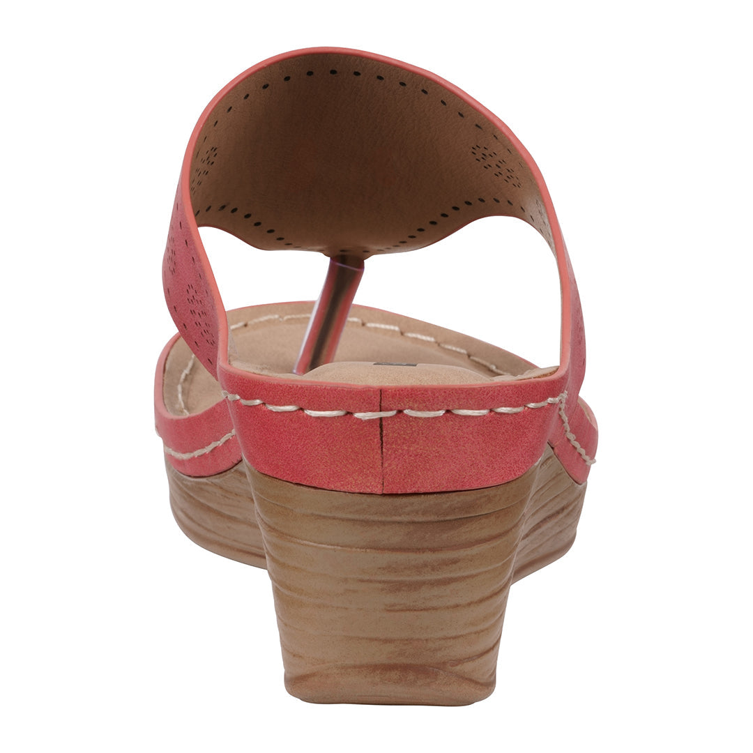 Pink wedge sandal on a white background