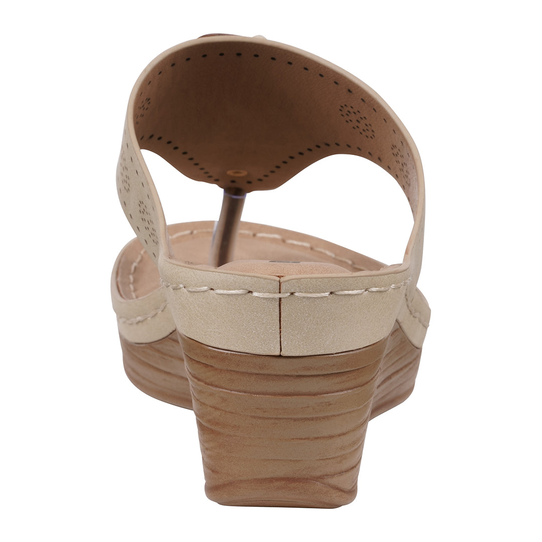 Beige sandal with a wedge sole on a white background