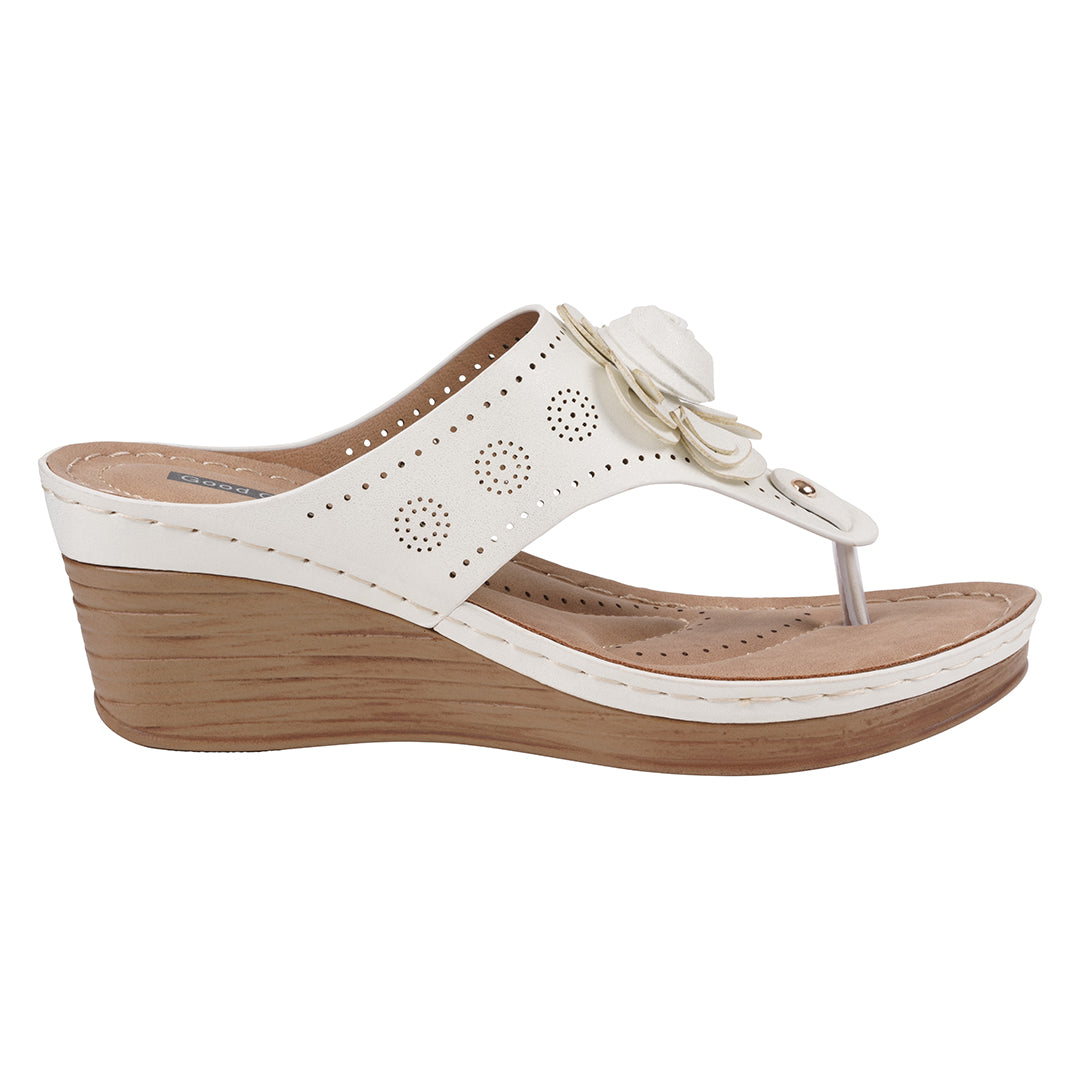White wedge sandal with a wooden sole on a white background