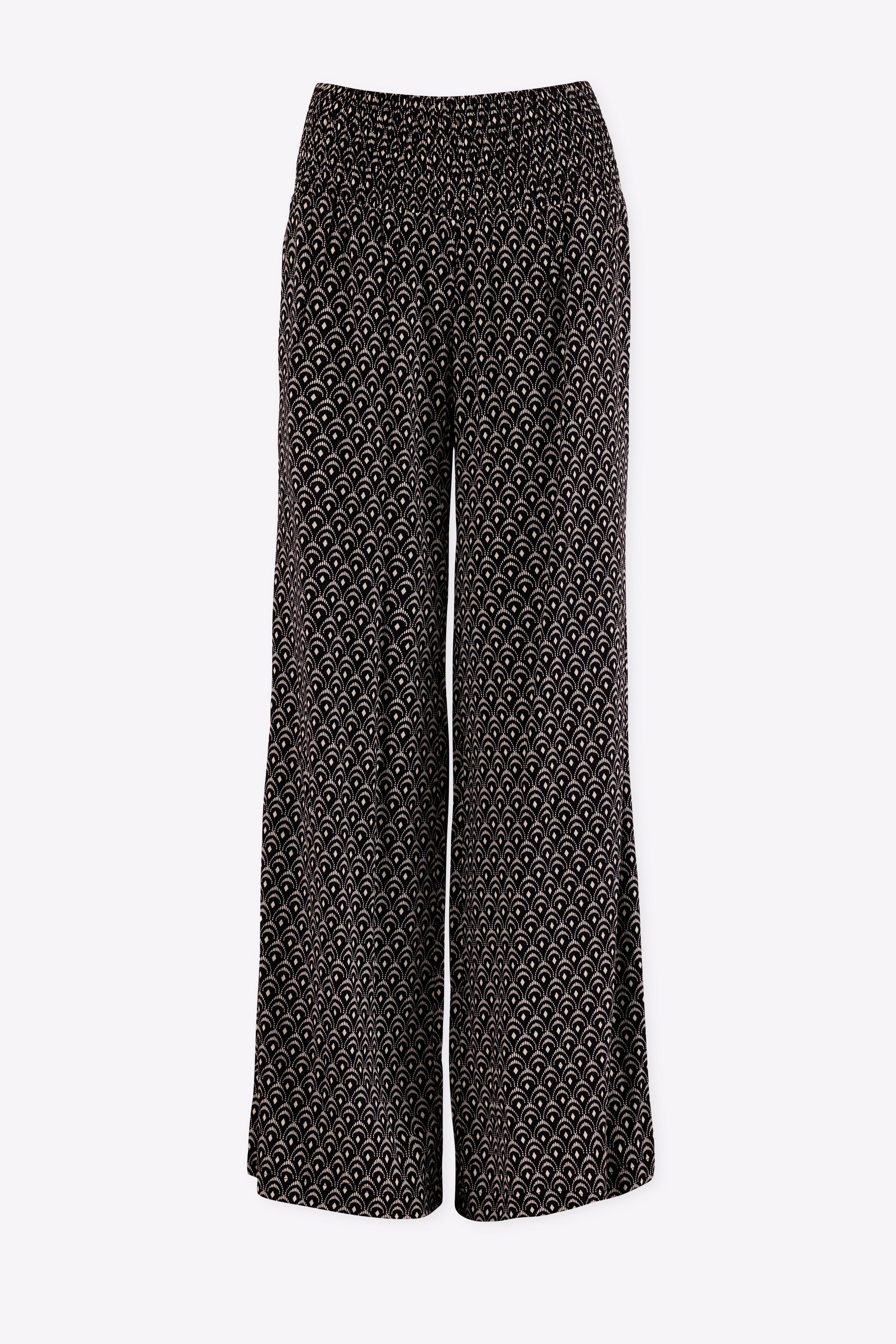 Black patterned pants on a white background