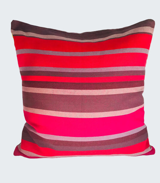 Striped red and brown pillow on a white background