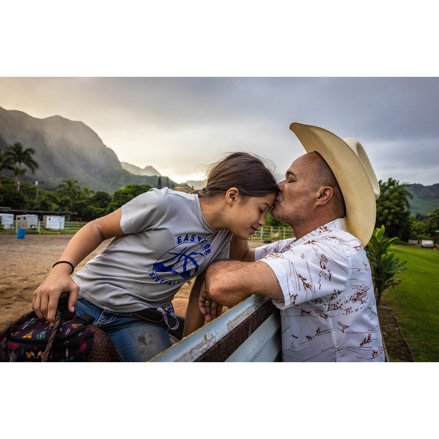 Man and woman embracing with mountains in the background