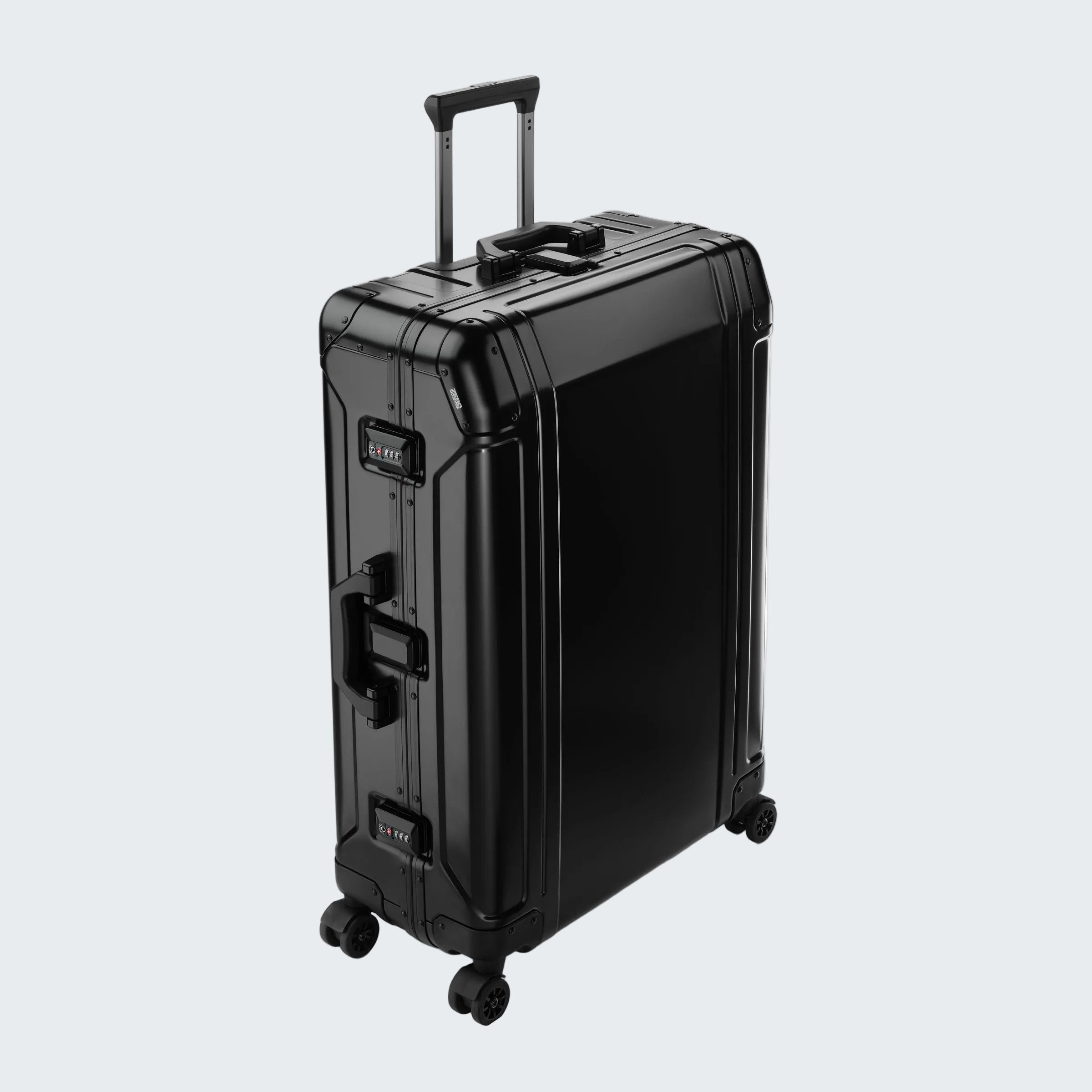 Black suitcase with wheels and handle on a white background
