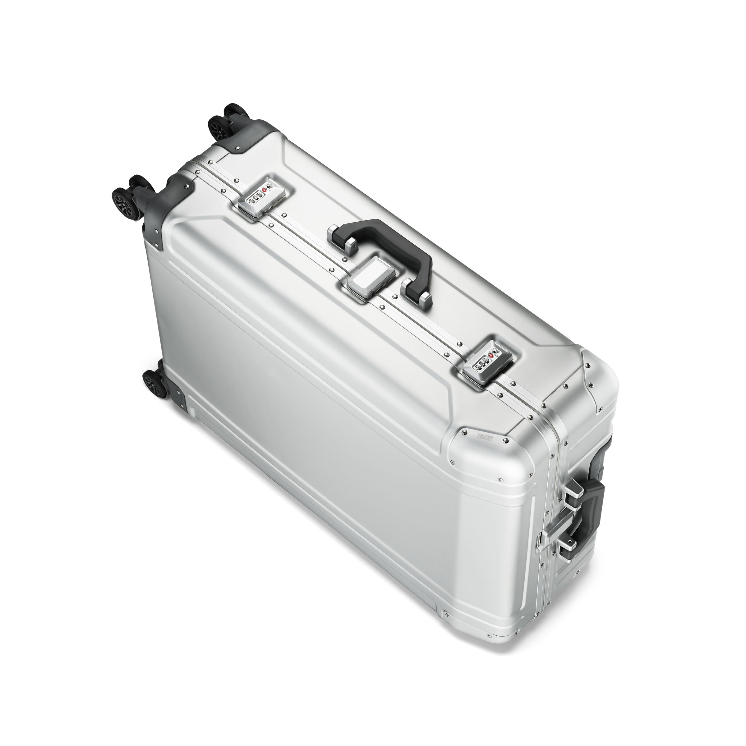Silver suitcase with black wheels and handle on a white background