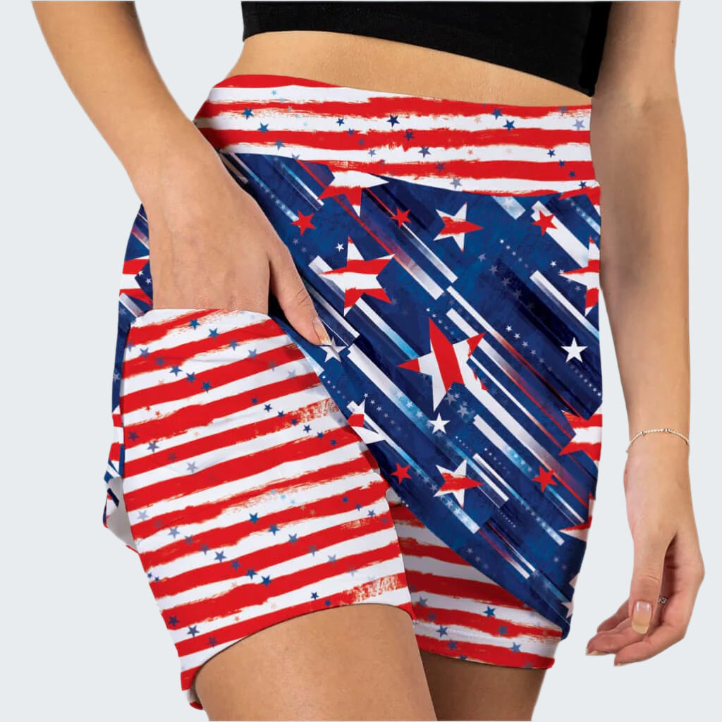 Person wearing a skirt with American flag pattern on a white background
